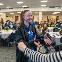 photo of Thompson Scholar being given honor cord